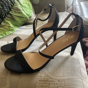 Thalia Sodi black gem dinner heels never worn with cross strap.